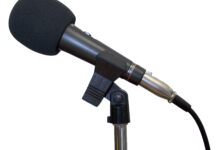 Studio microphone with foam windscreen on a stand
