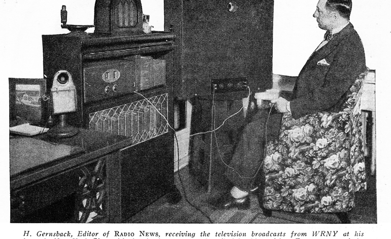 Hugo Gernsback watching an early mechanical television set in 1928