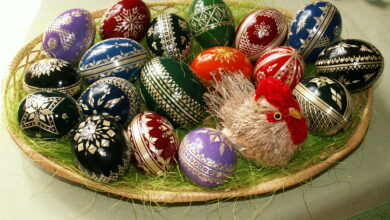 Colourful decorated Easter eggs arranged on straw for spring celebration