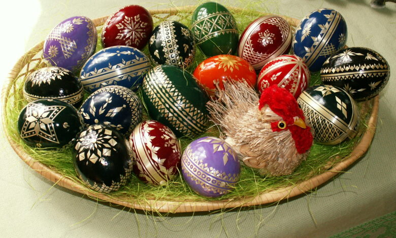 Colourful decorated Easter eggs arranged on straw for spring celebration