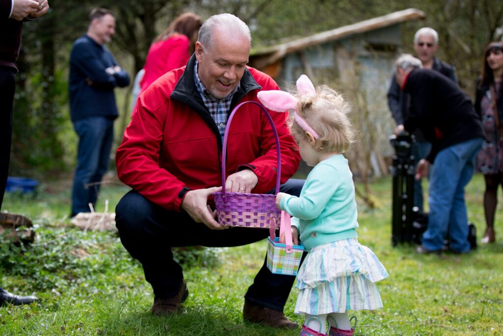 Children taking part in an Easter egg hunt outdoors