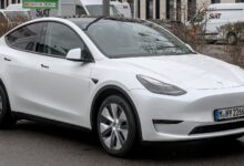 Tesla Model Y electric SUV driving on the road