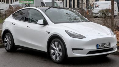 Tesla Model Y electric SUV driving on the road