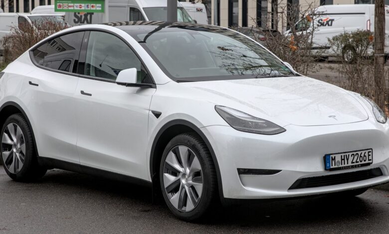 Tesla Model Y electric SUV driving on the road